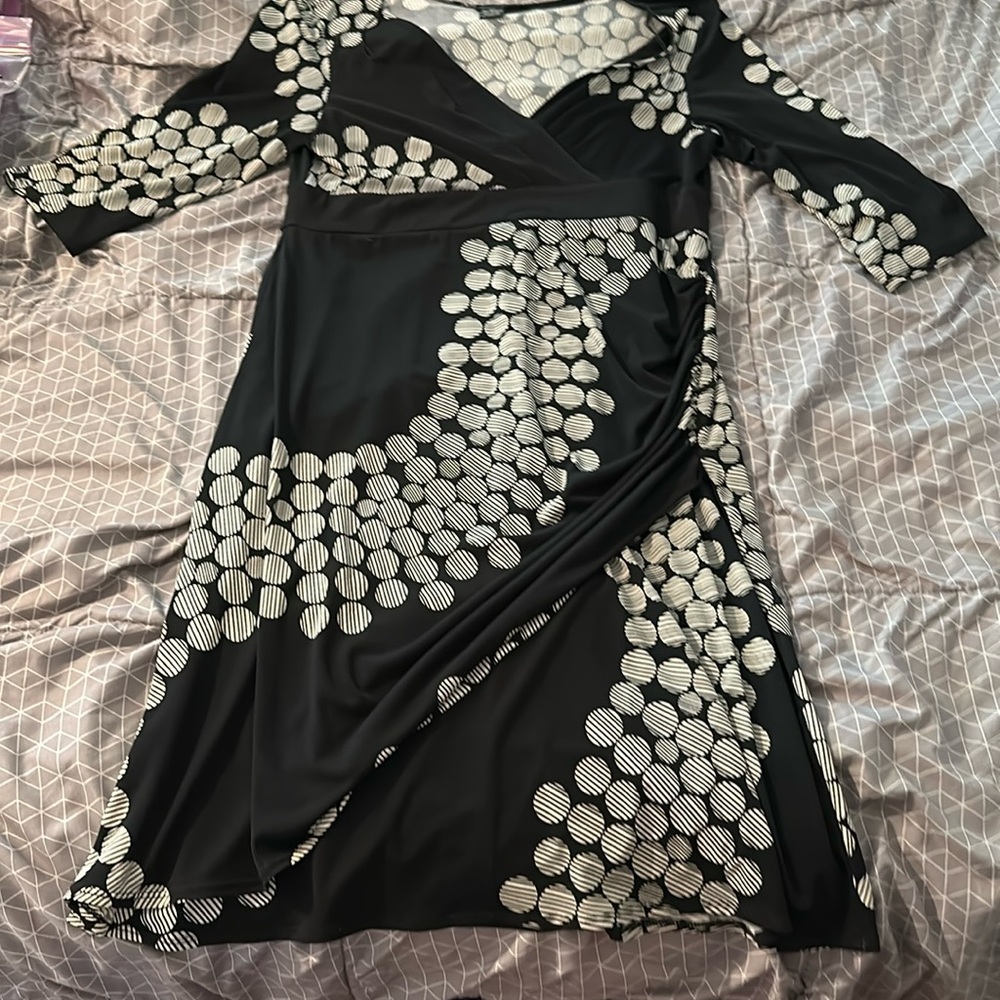 Three-quarter sleeve black pho wrap mid length dress.. unlined